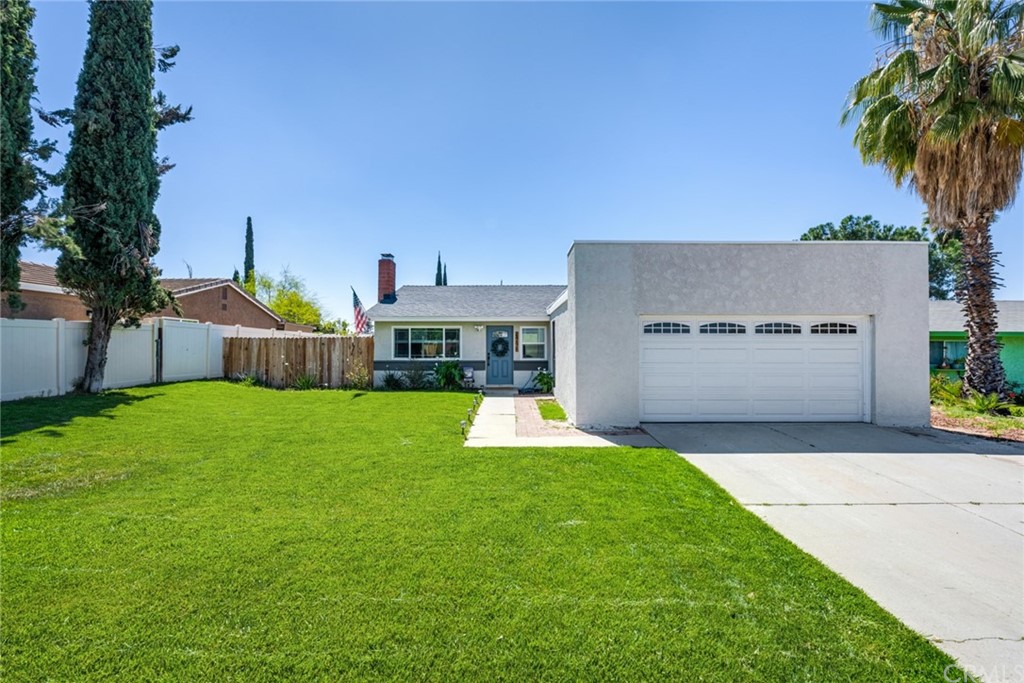 24675 Singer Street Moreno Valley, CA 92557 - Photo 1 of 1 a front view of house with yard and outdoor seating