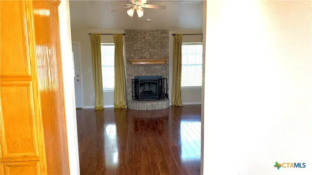 a view of a livingroom with furniture and a fireplace