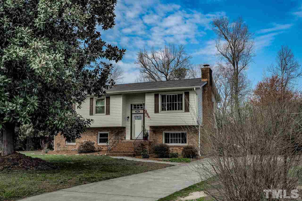 3953 Haithcock Road Raleigh, NC 27604 - Photo 1 of 25 a front view of a house with a garden