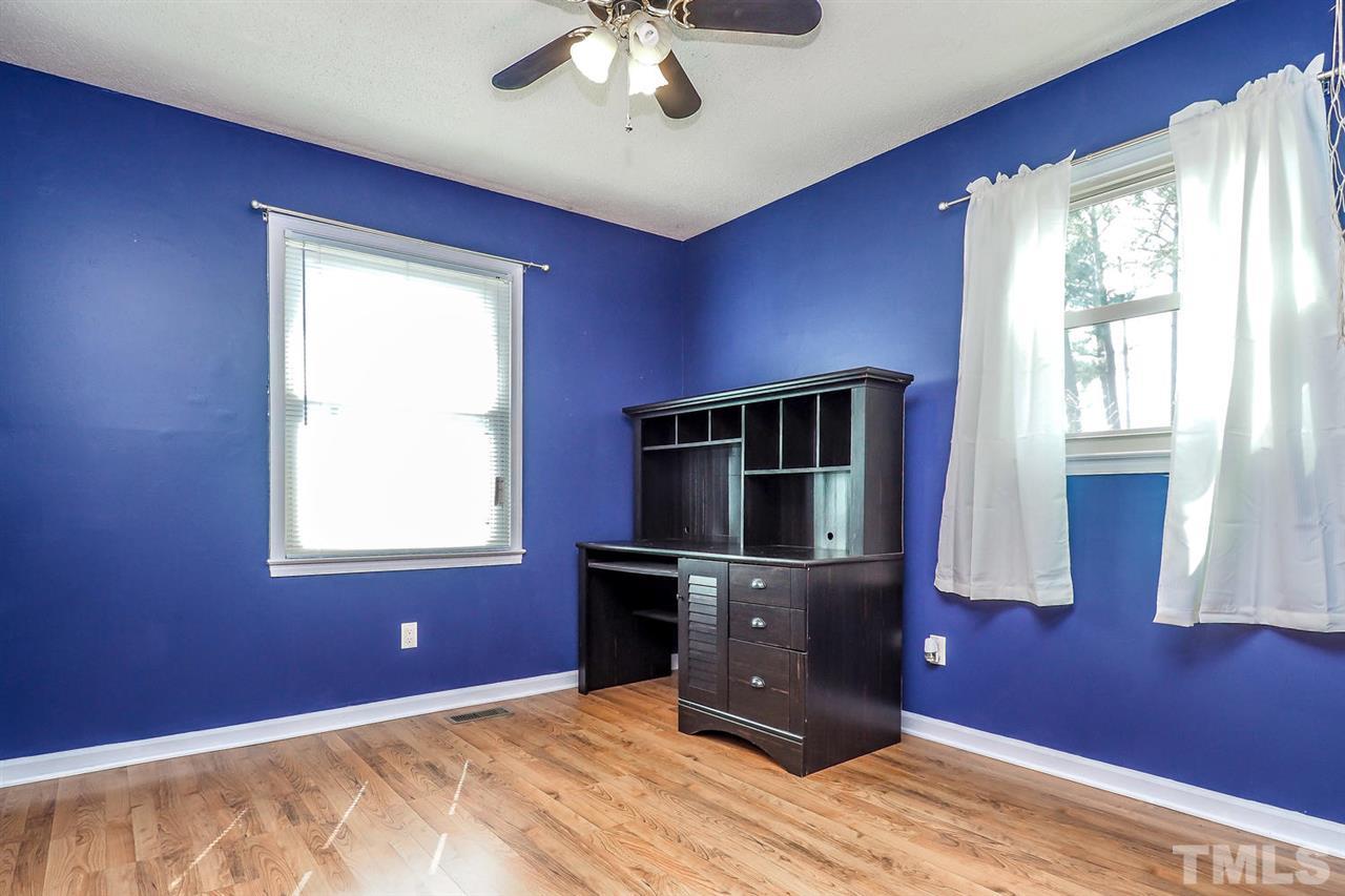3953 Haithcock Road Raleigh, NC 27604 - Photo 12 of 25 a room with furniture and windows