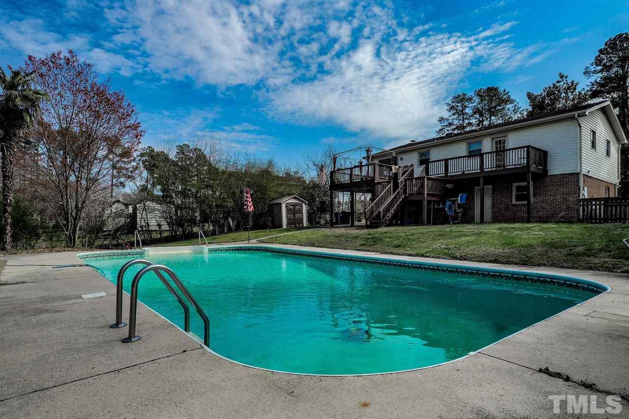 3953 Haithcock Road Raleigh, NC 27604 - Photo 18 of 25 a view of swimming pool with a yard