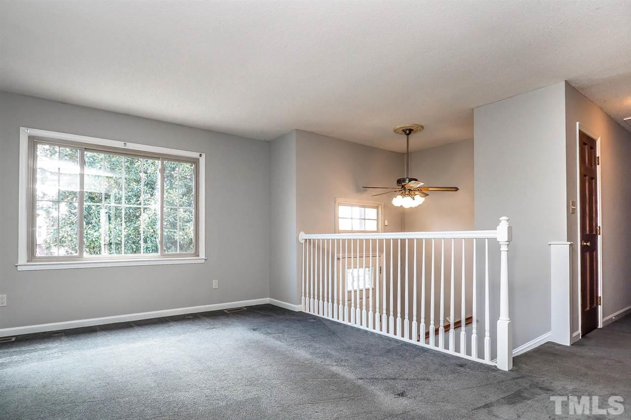 3953 Haithcock Road Raleigh, NC 27604 - Photo 3 of 25 en empty room with windows
