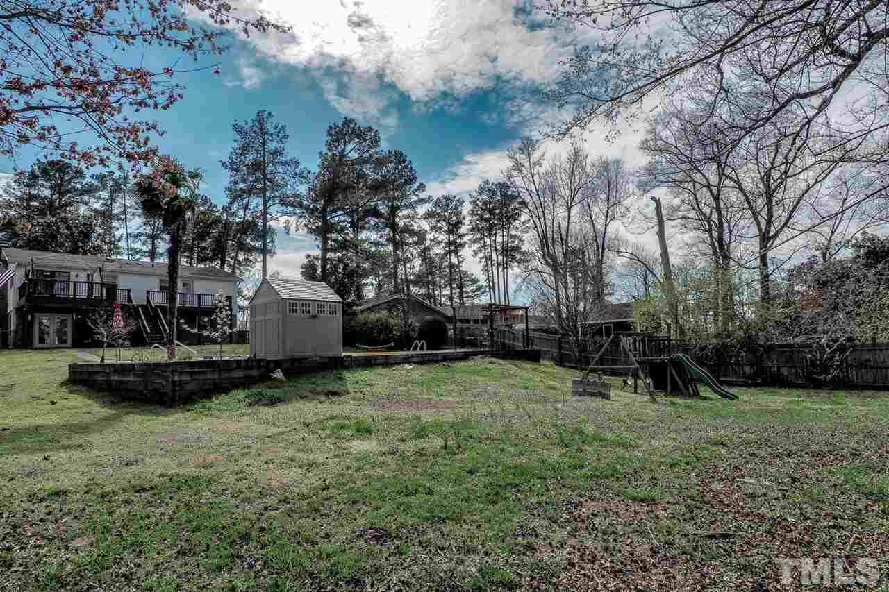 3953 Haithcock Road Raleigh, NC 27604 - Photo 24 of 25 a view of backyard with slide