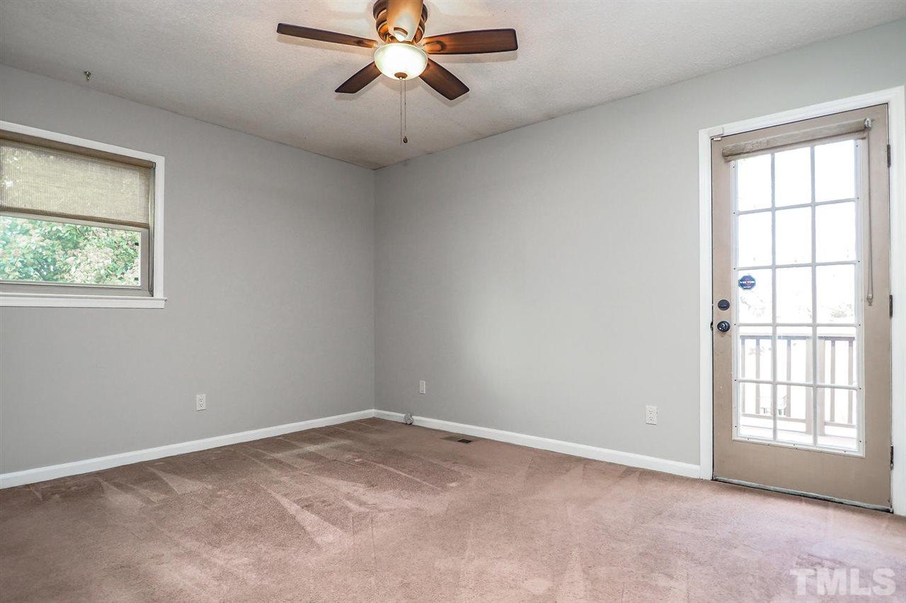 3953 Haithcock Road Raleigh, NC 27604 - Photo 8 of 25 a view of an empty room with a window