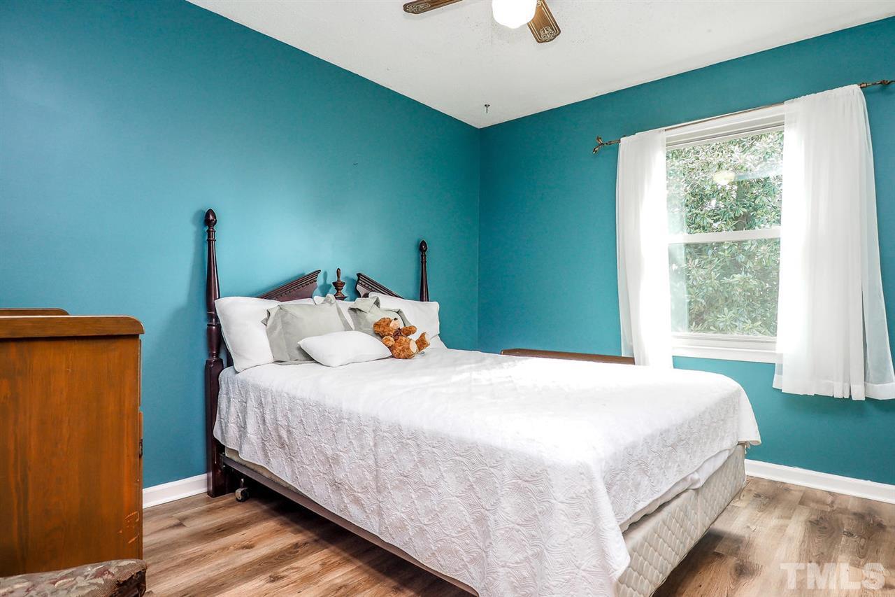 3953 Haithcock Road Raleigh, NC 27604 - Photo 10 of 25 a bedroom with a bed and a window