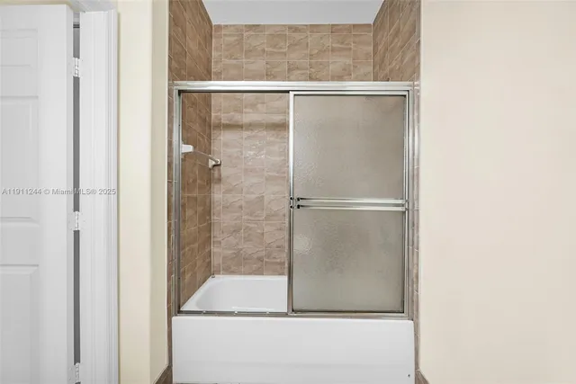 a view of an empty room with windows