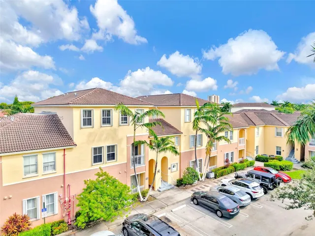 a view of a patio with swimming pool table and chairs