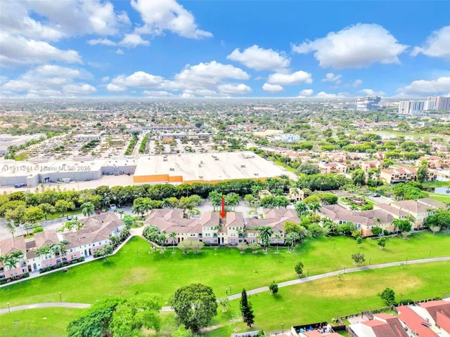 a view of a golf course with a swimming pool