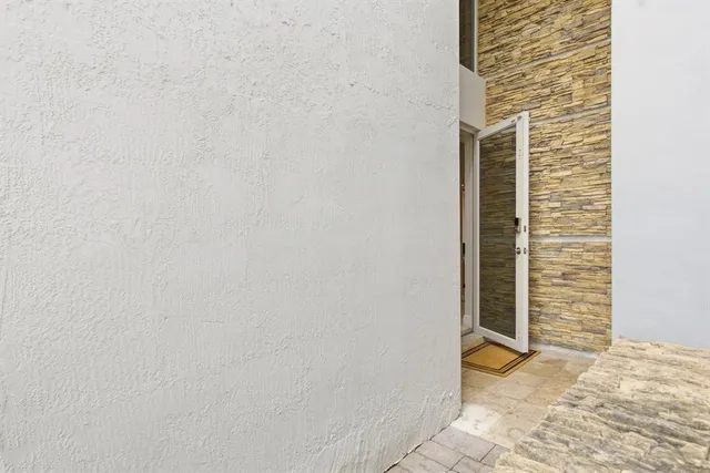 a brick building with a glass door