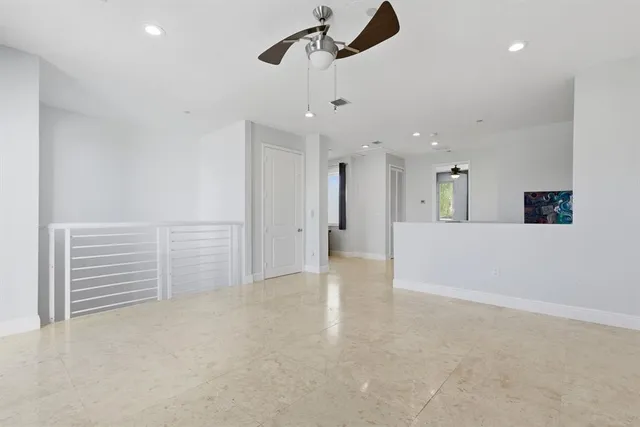 a view of a workspace with furniture and wooden floor