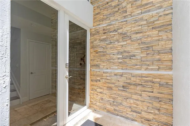 a view of entryway with white walls