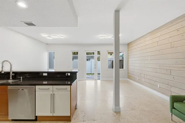 a view of an empty room and a window