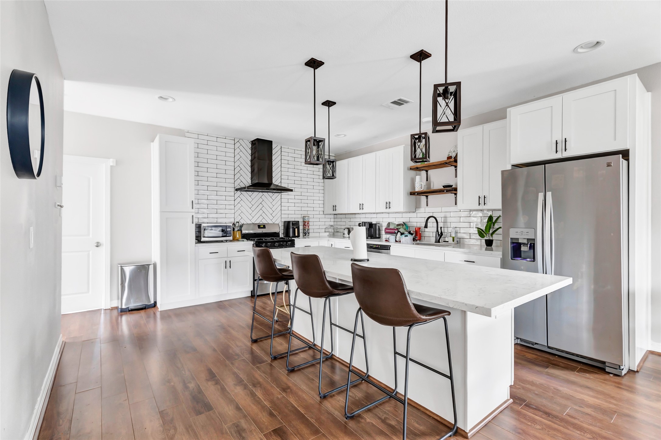 109 North Super Street Houston, TX 77011 - Photo 6 of 28 Beautiful Stainless steel appliances, marble countertops, and laminate flooring