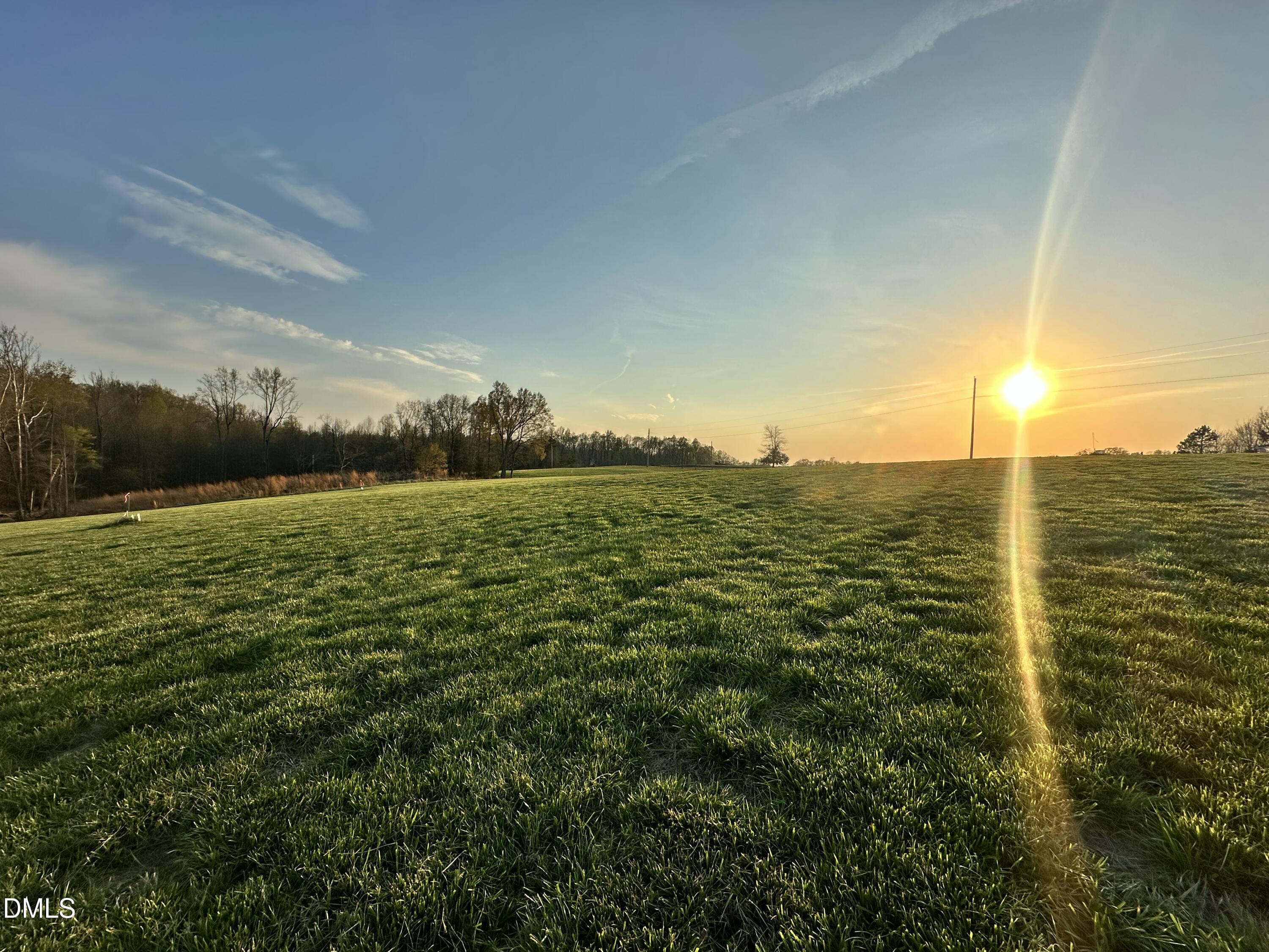 6.62-acres Jones Road Hurdle Mills, NC 27541 - Photo 6 of 9 a view of a large body of water with a mountain
