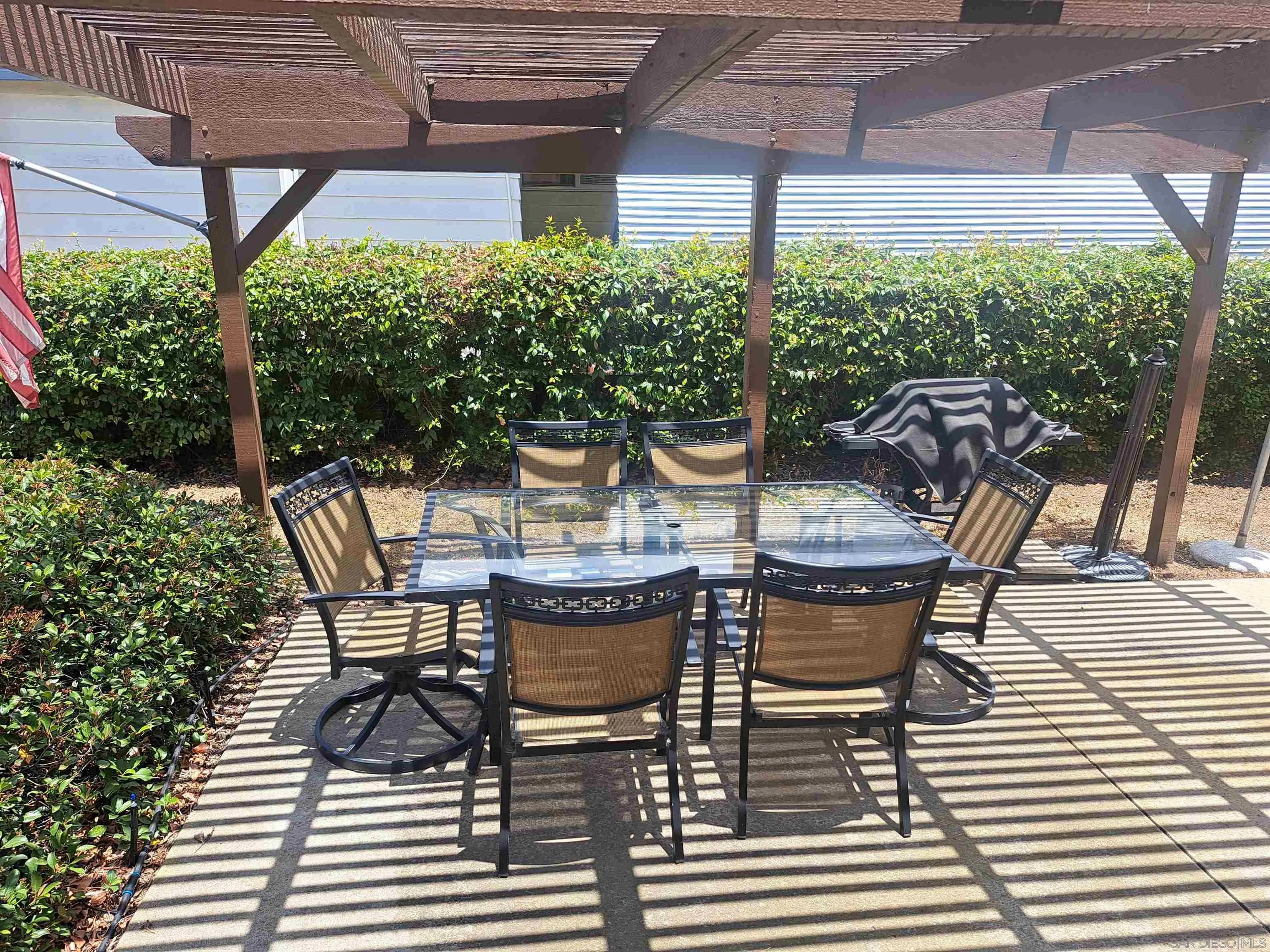 4650 Dulin Road, Unit 12 Fallbrook, CA 92003 - Photo 9 of 36 a view of two chairs and table in the patio