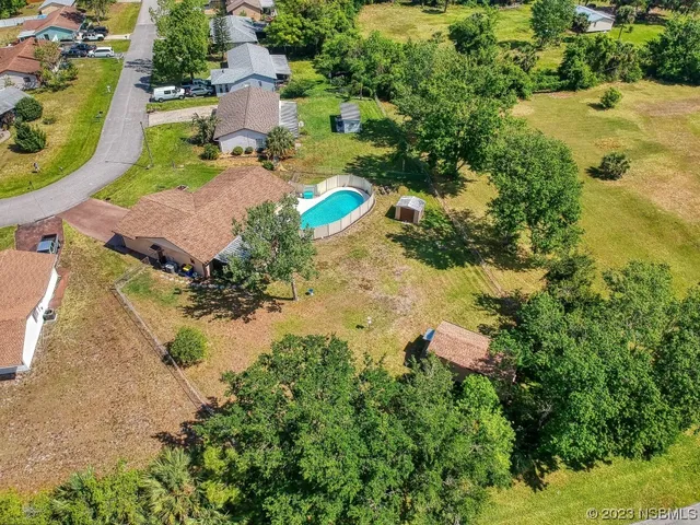 an aerial view of residential house with outdoor space