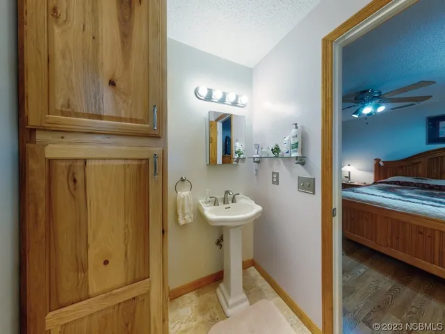 a dining room with furniture and a garden view