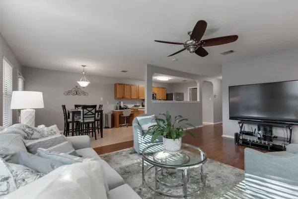 a living room with furniture and a flat screen tv