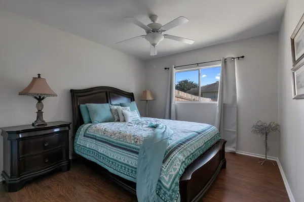 a bedroom with a bed and a dresser