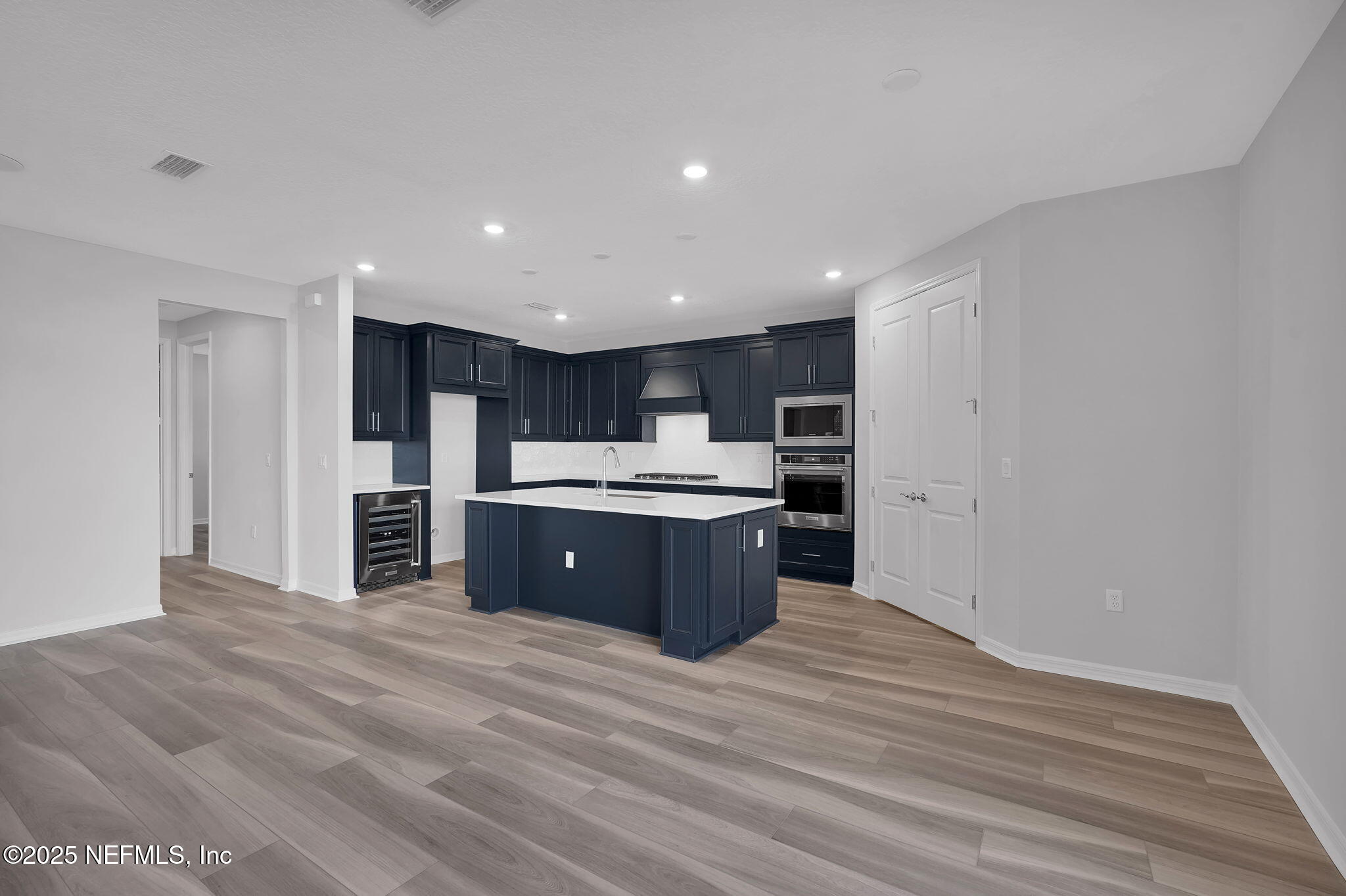 133 Beechnut Circle St. Augustine, FL 32095 - Photo 16 of 53 a kitchen with stainless steel appliances kitchen island wooden cabinets and granite counter tops