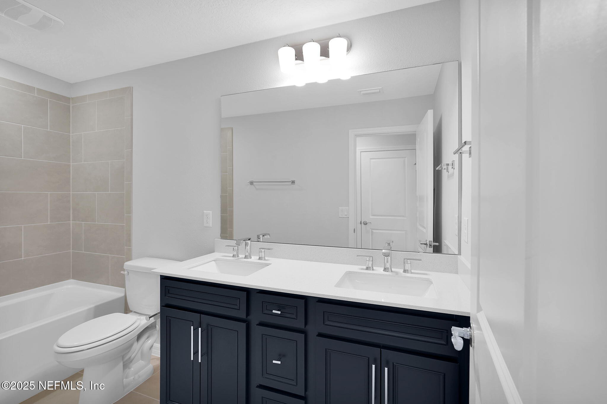 133 Beechnut Circle St. Augustine, FL 32095 - Photo 28 of 53 a bathroom with a sink and a mirror