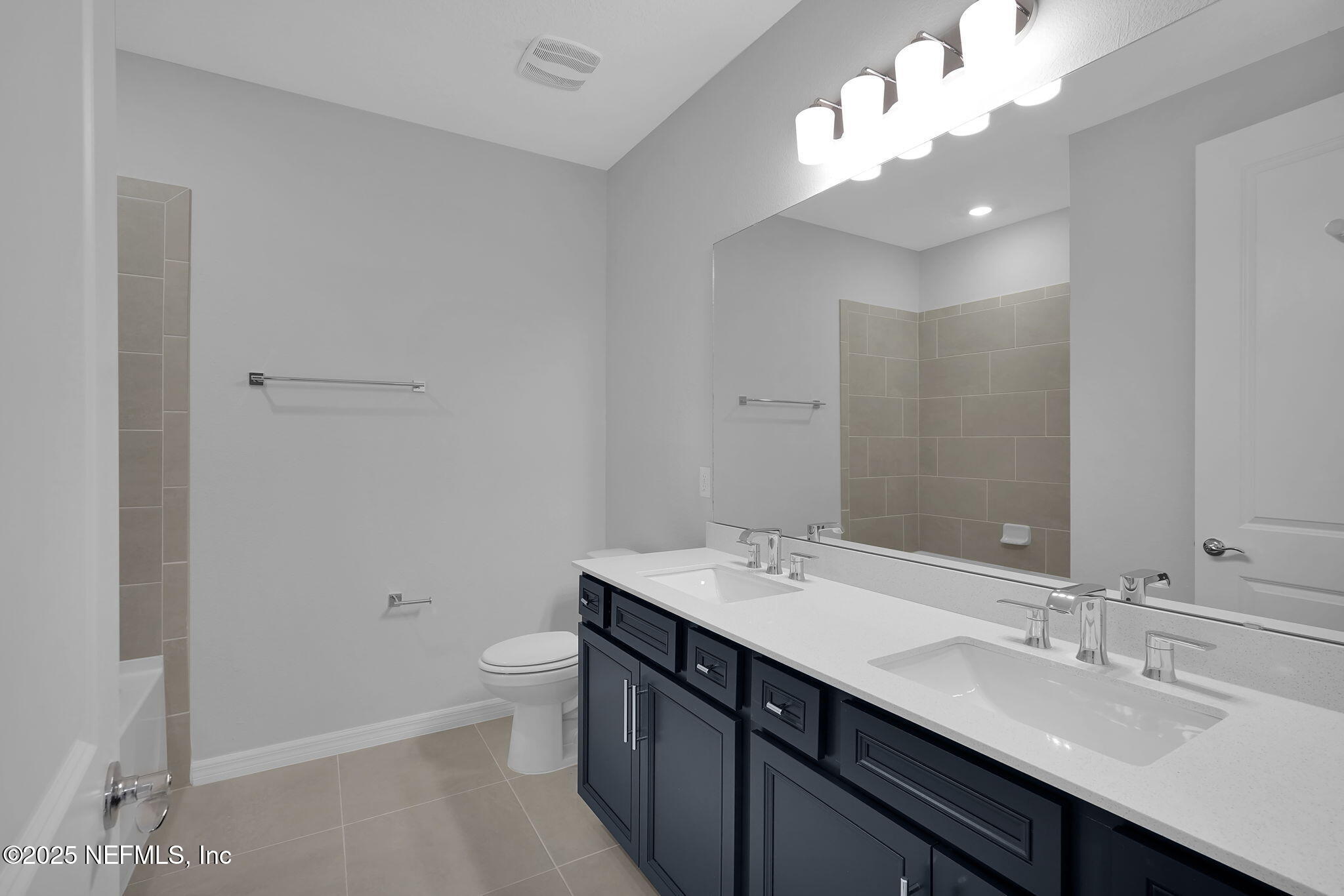 133 Beechnut Circle St. Augustine, FL 32095 - Photo 31 of 53 a bathroom with a double vanity sink mirror and toilet