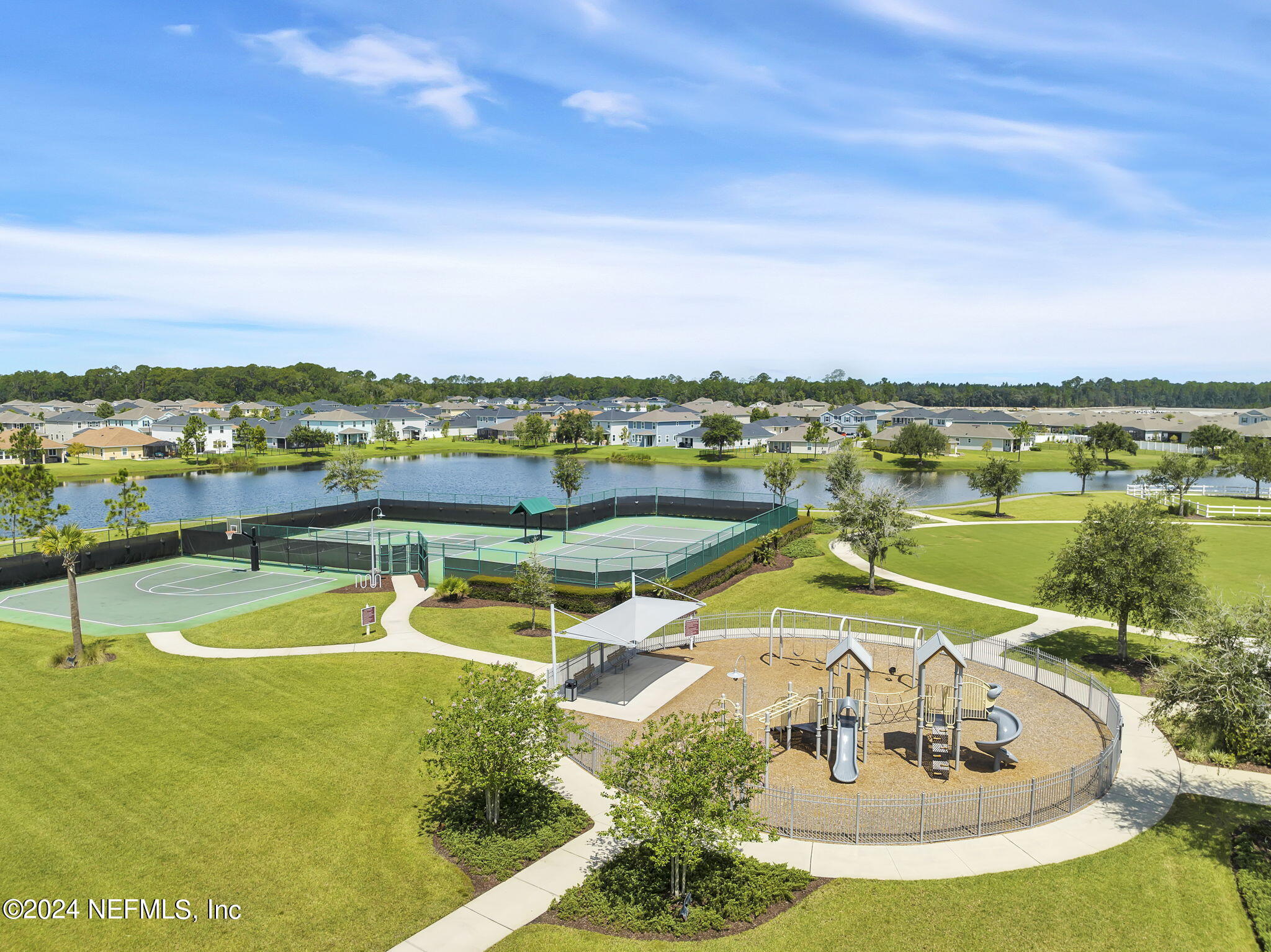 133 Beechnut Circle St. Augustine, FL 32095 - Photo 48 of 53 a view of a swimming pool with a table and chairs