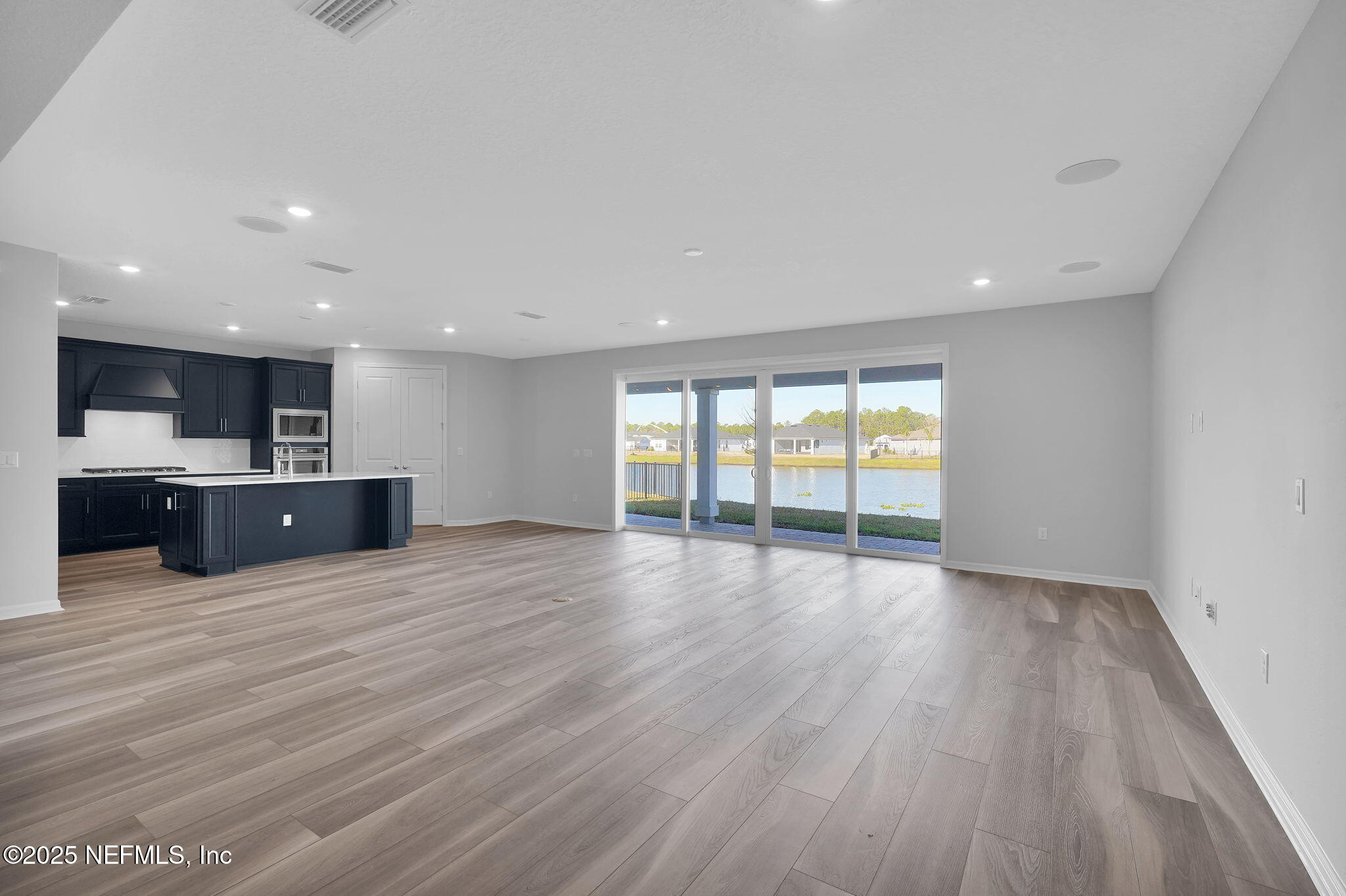 133 Beechnut Circle St. Augustine, FL 32095 - Photo 10 of 53 a view of an empty room with wooden floor and a window