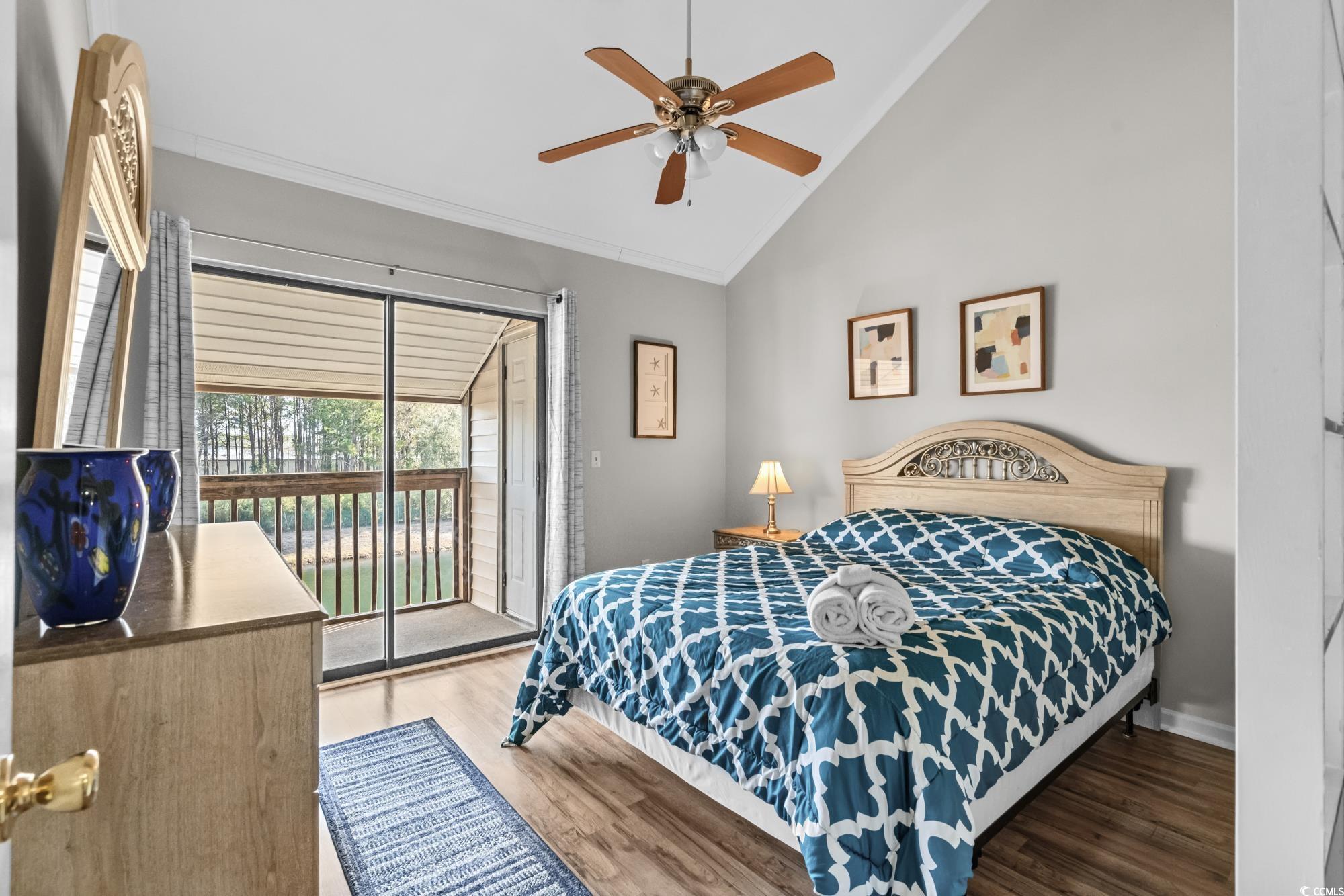 1356 Glenns Bay Road, Unit 203D Surfside Beach, SC 29575 - Photo 17 of 38 Bedroom featuring light wood-style floors, access to exterior, high vaulted ceiling, and ceiling fan