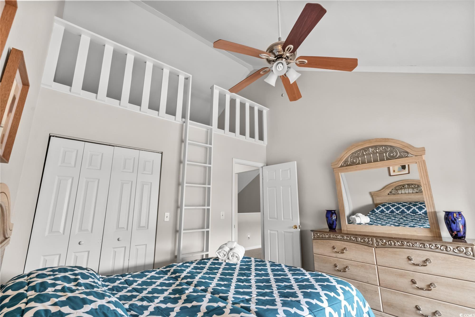 1356 Glenns Bay Road, Unit 203D Surfside Beach, SC 29575 - Photo 20 of 38 Bedroom featuring a high ceiling, a closet, and ceiling fan
