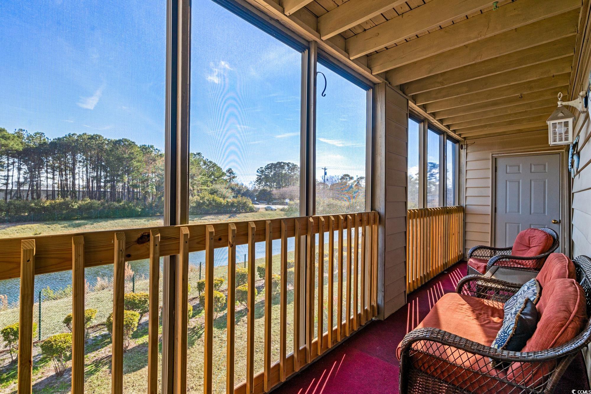 1356 Glenns Bay Road, Unit 203D Surfside Beach, SC 29575 - Photo 24 of 38 Sunroom / solarium with a balcony