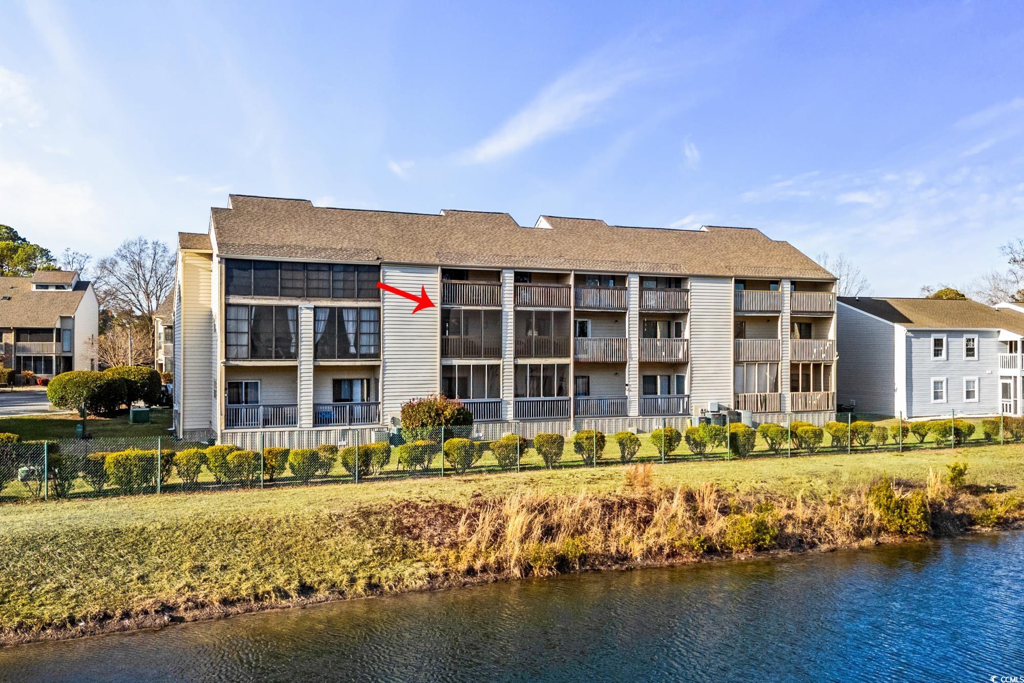 1356 Glenns Bay Road, Unit 203D Surfside Beach, SC 29575 - Photo 28 of 38 View of apartment building / complex with a water view