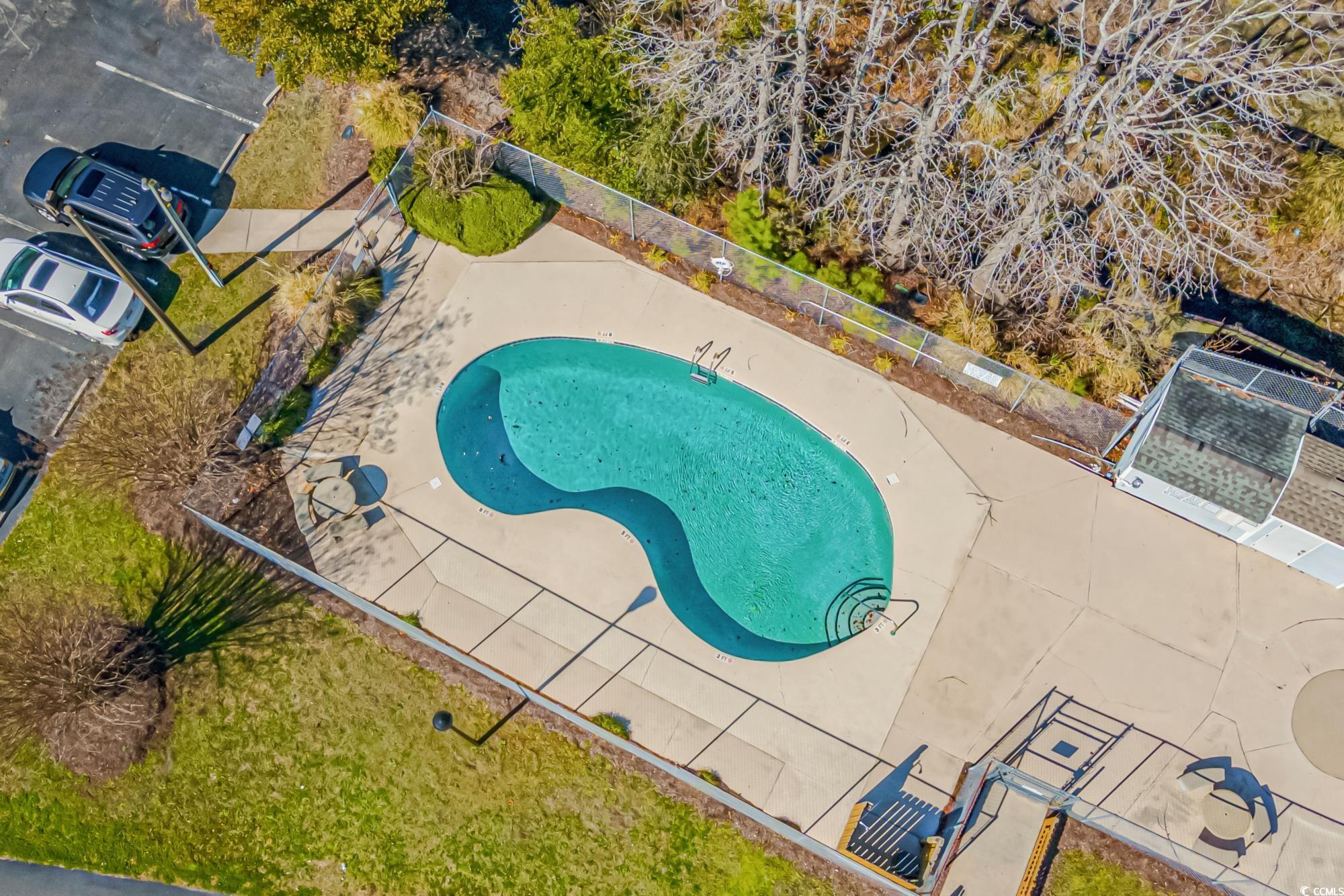 1356 Glenns Bay Road, Unit 203D Surfside Beach, SC 29575 - Photo 29 of 38 Aerial view of a pool