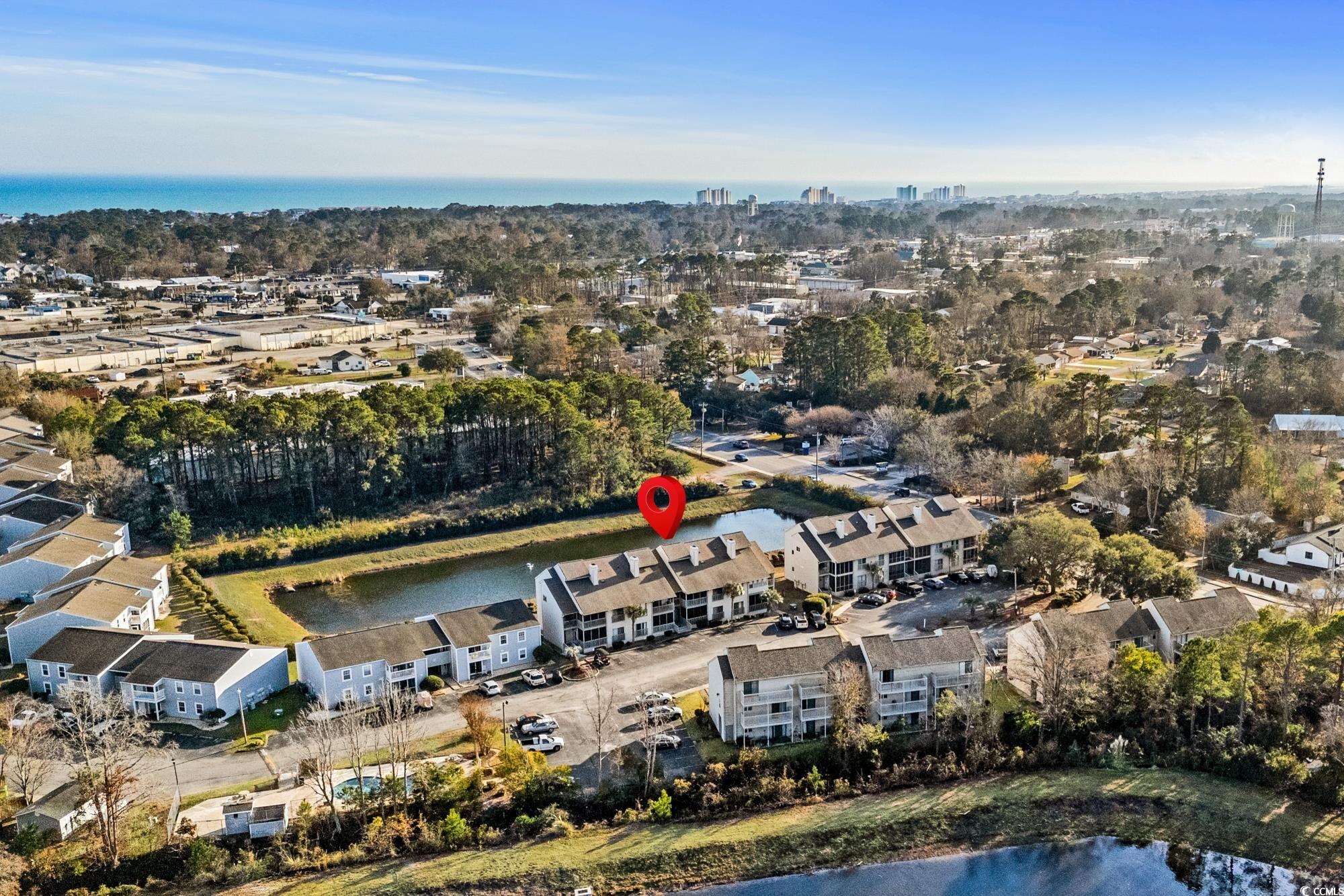1356 Glenns Bay Road, Unit 203D Surfside Beach, SC 29575 - Photo 32 of 38 Aerial view of property's location featuring a nearby body of water and a tree filled landscape