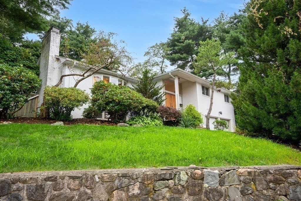 33 Sky View Circle Newton, MA 02459 - Photo 1 of 42 a front view of a house with garden