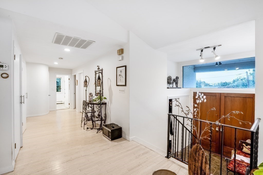 33 Sky View Circle Newton, MA 02459 - Photo 11 of 42 a view of a livingroom with furniture and white walls