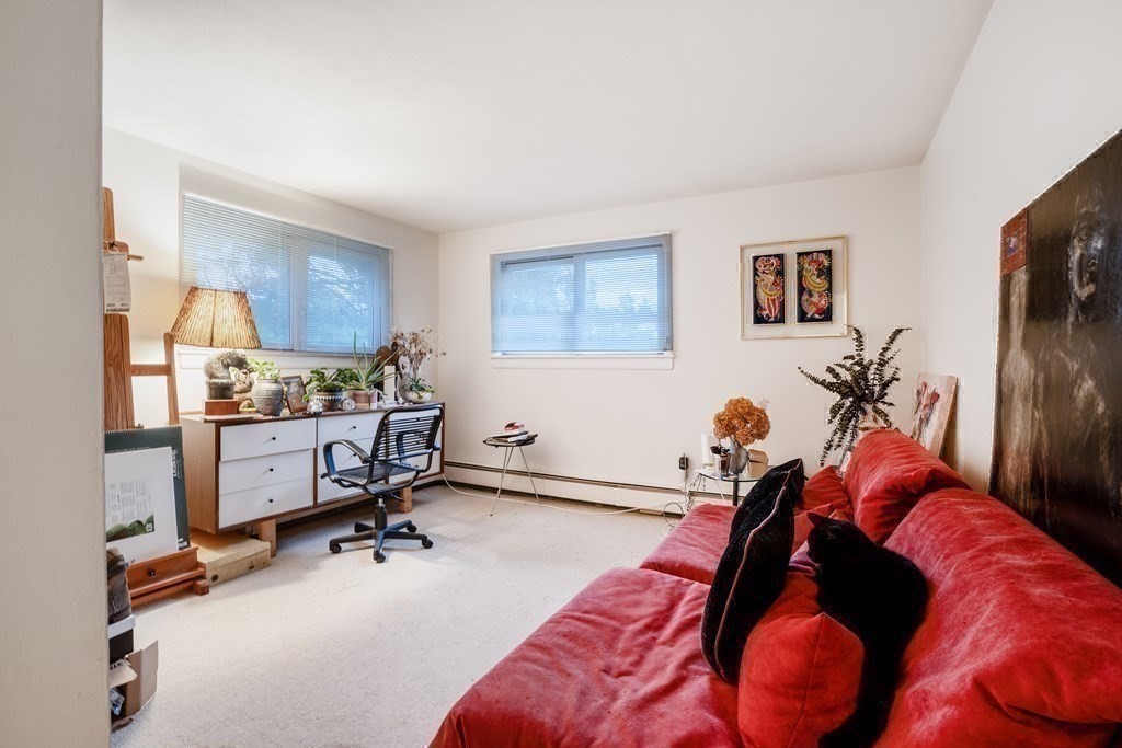 33 Sky View Circle Newton, MA 02459 - Photo 12 of 42 a view of a bedroom with workspace and a window
