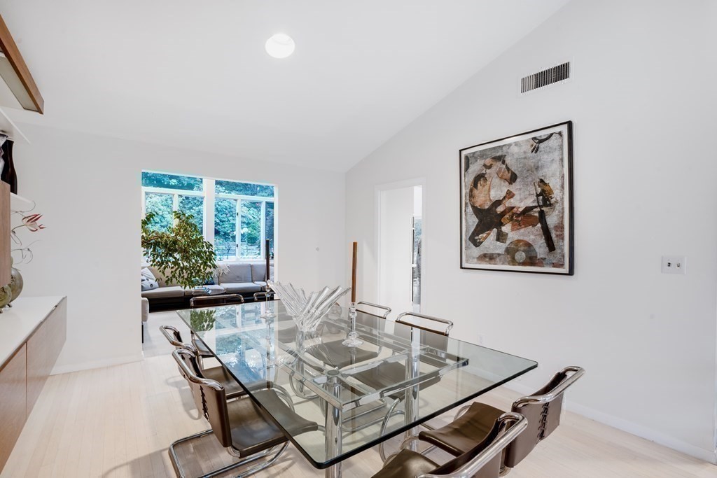 33 Sky View Circle Newton, MA 02459 - Photo 16 of 42 a view of a dining room with furniture and a potted plant
