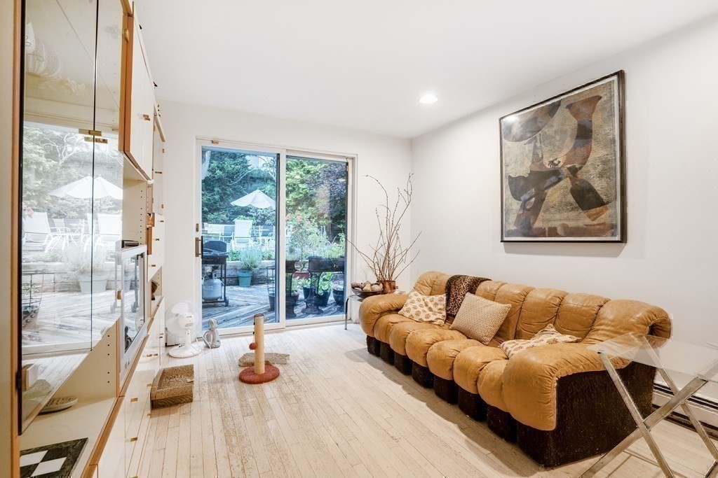 33 Sky View Circle Newton, MA 02459 - Photo 17 of 42 a living room with furniture and a large window