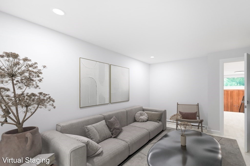 33 Sky View Circle Newton, MA 02459 - Photo 19 of 42 a living room with furniture and a potted plant