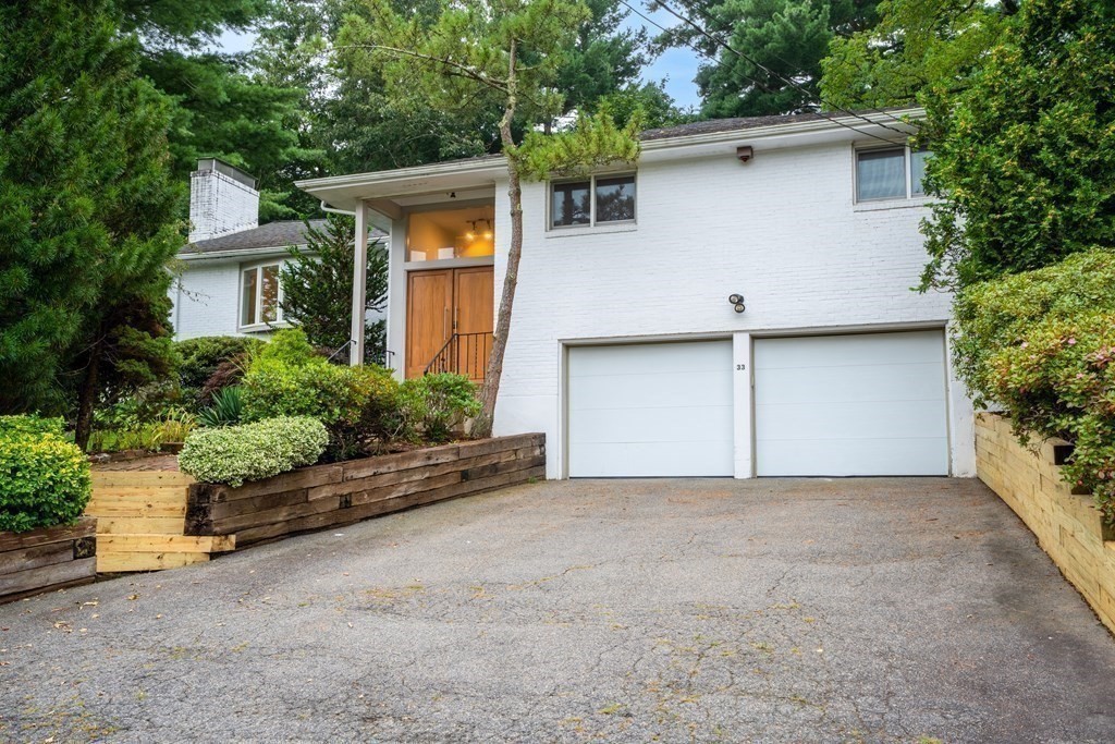 33 Sky View Circle Newton, MA 02459 - Photo 20 of 42 a view of a house with a yard and potted plants