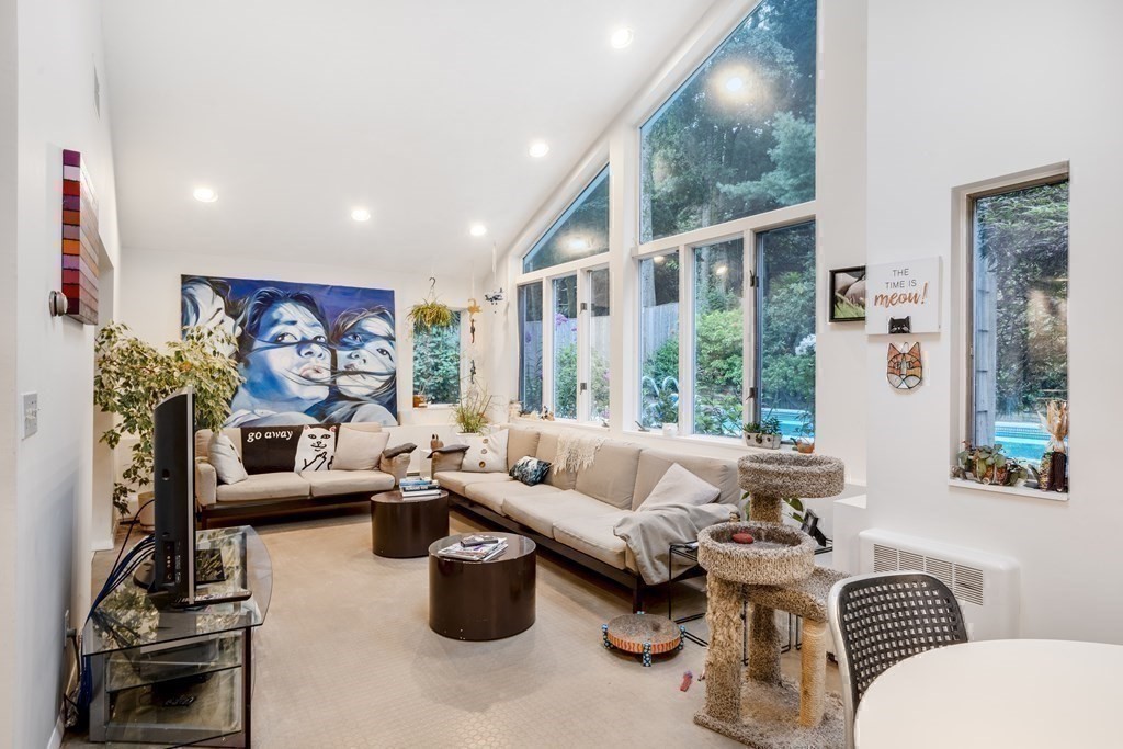 33 Sky View Circle Newton, MA 02459 - Photo 24 of 42 a living room with furniture and a large window