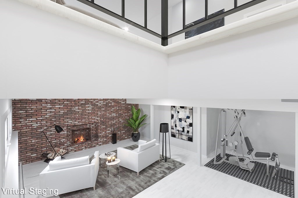 33 Sky View Circle Newton, MA 02459 - Photo 27 of 42 a living room with furniture and a fireplace