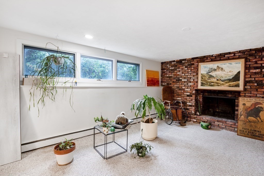 33 Sky View Circle Newton, MA 02459 - Photo 28 of 42 a living room with furniture and a fireplace