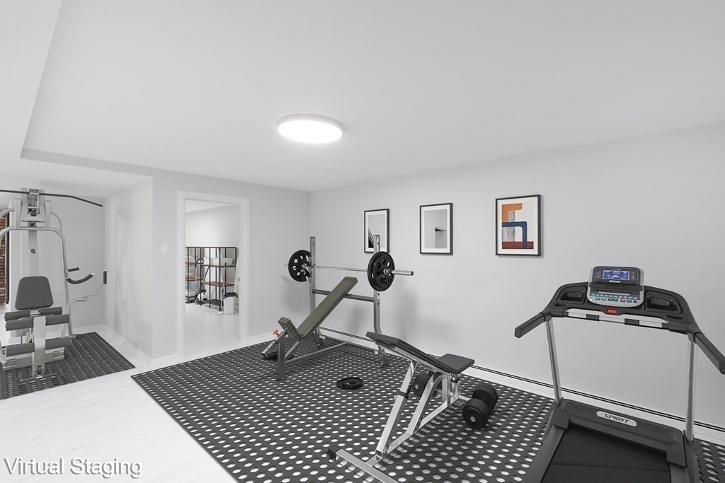 33 Sky View Circle Newton, MA 02459 - Photo 31 of 42 a living room with a couch and a table