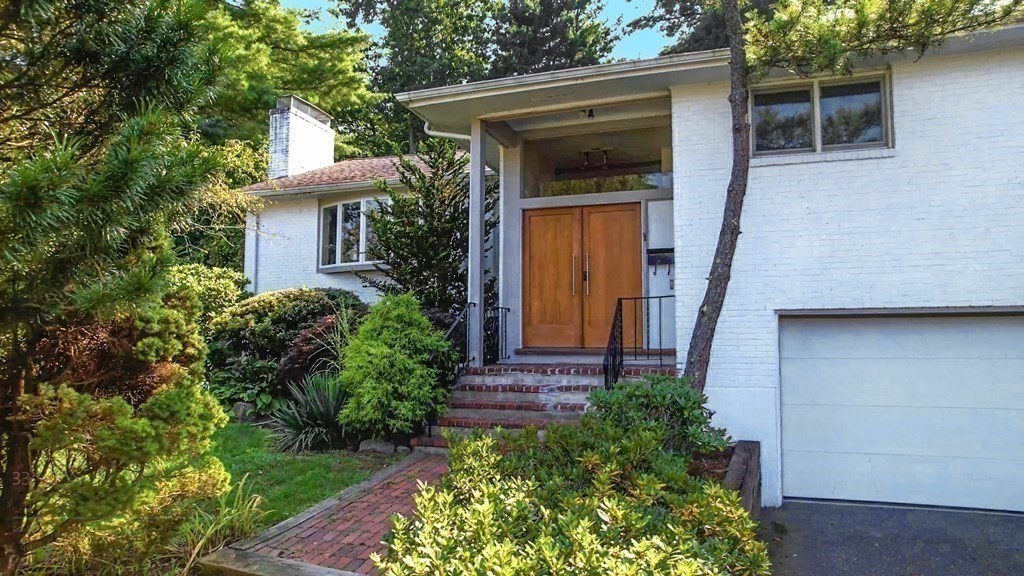33 Sky View Circle Newton, MA 02459 - Photo 35 of 42 a front view of a house with garden
