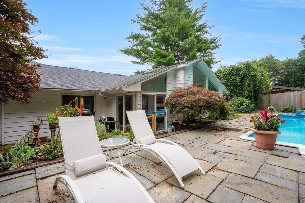 33 Sky View Circle Newton, MA 02459 - Photo 37 of 42 a view of backyard with chair and potted plants
