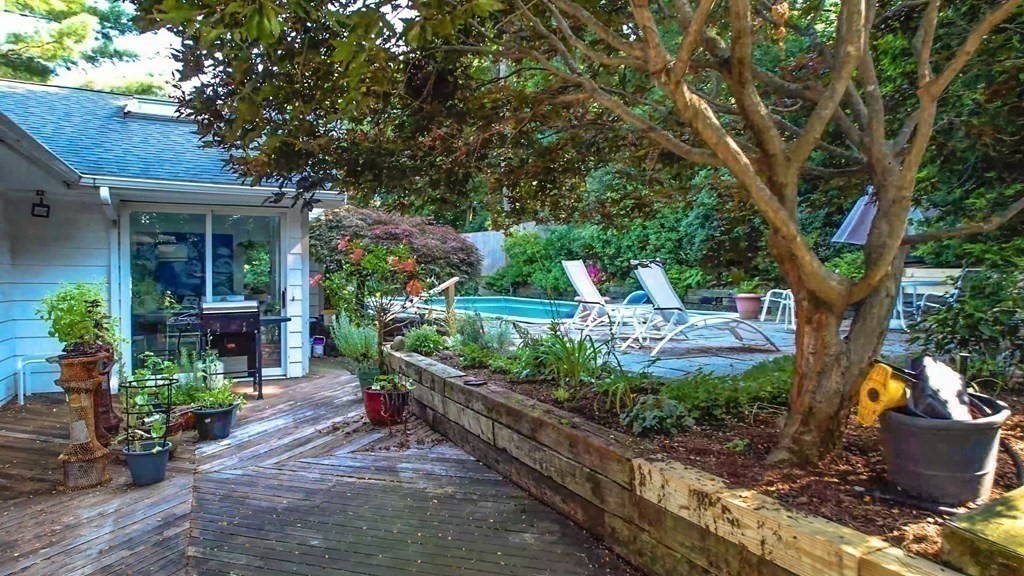 33 Sky View Circle Newton, MA 02459 - Photo 8 of 42 a view of a house with a yard and potted plants