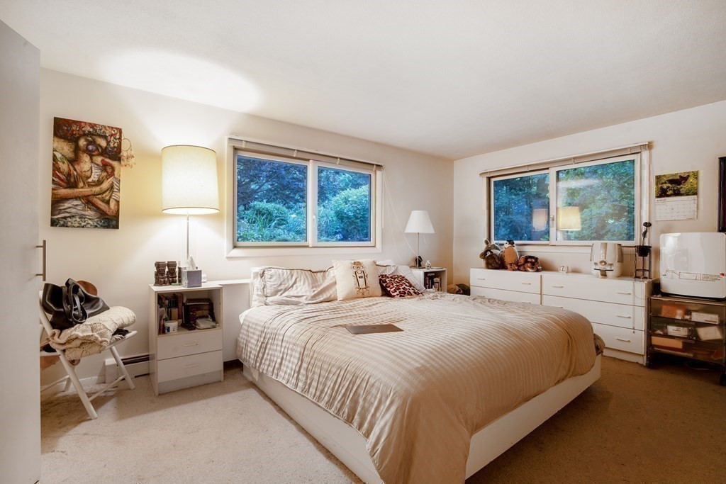 33 Sky View Circle Newton, MA 02459 - Photo 10 of 42 a bedroom with a bed and wooden floor