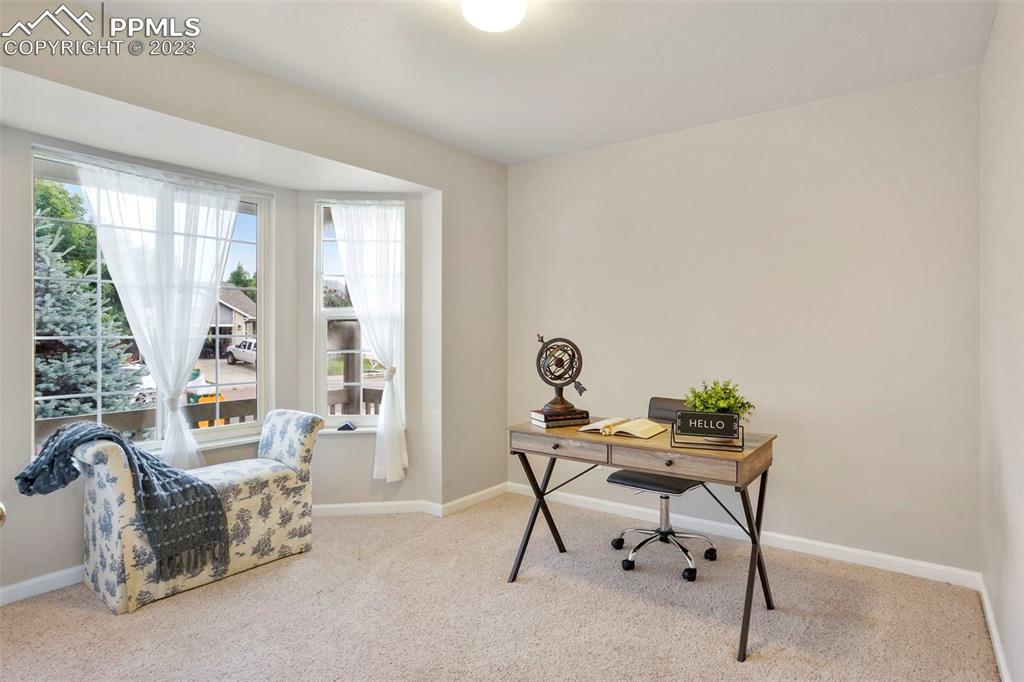 4748 Brant Road Colorado Springs, CO 80911 - Photo 13 of 19 a work room with furniture and windows